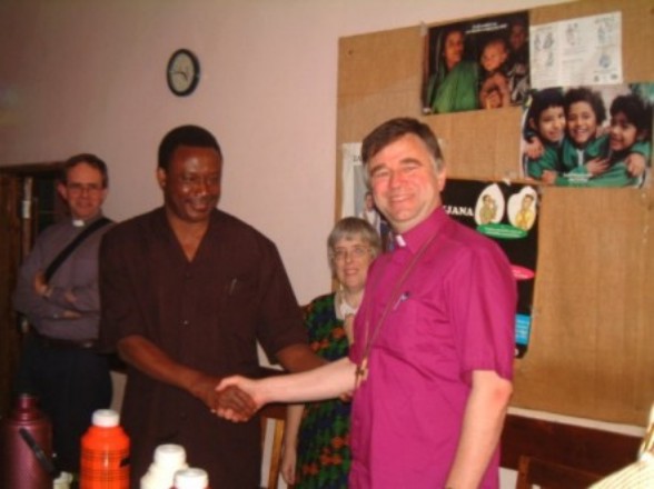Col. E Mfuru, DC of Mpwapwa District shakes hands with +Brian Castle - Link Partners from the Diocese of Rochester in the UK