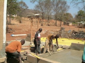 Mengi Kapingo & Joseph Mlulu taking care with a detail of the flooring
