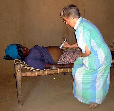 Dr Rachel listens to a patient's Foetal Heart Rate